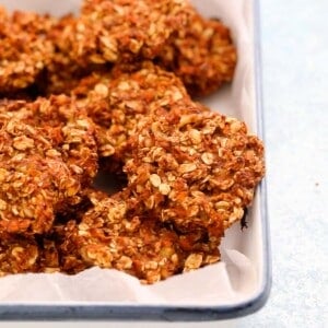 carrot cookies placed in a white enamel tray.