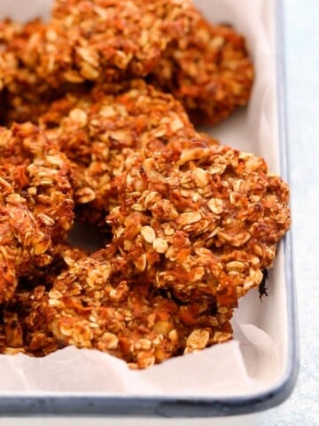 carrot cookies placed in a white enamel tray.