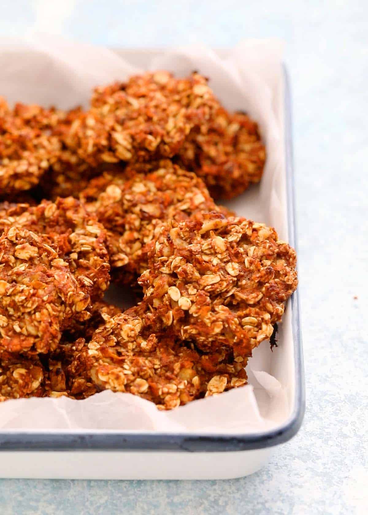 carrot cookies placed in a white rectangular tray.