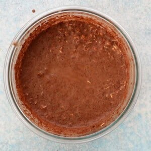 brown chocolate oats in a glass bowl.