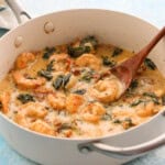 creamy Tuscan shrimp in a white pan.