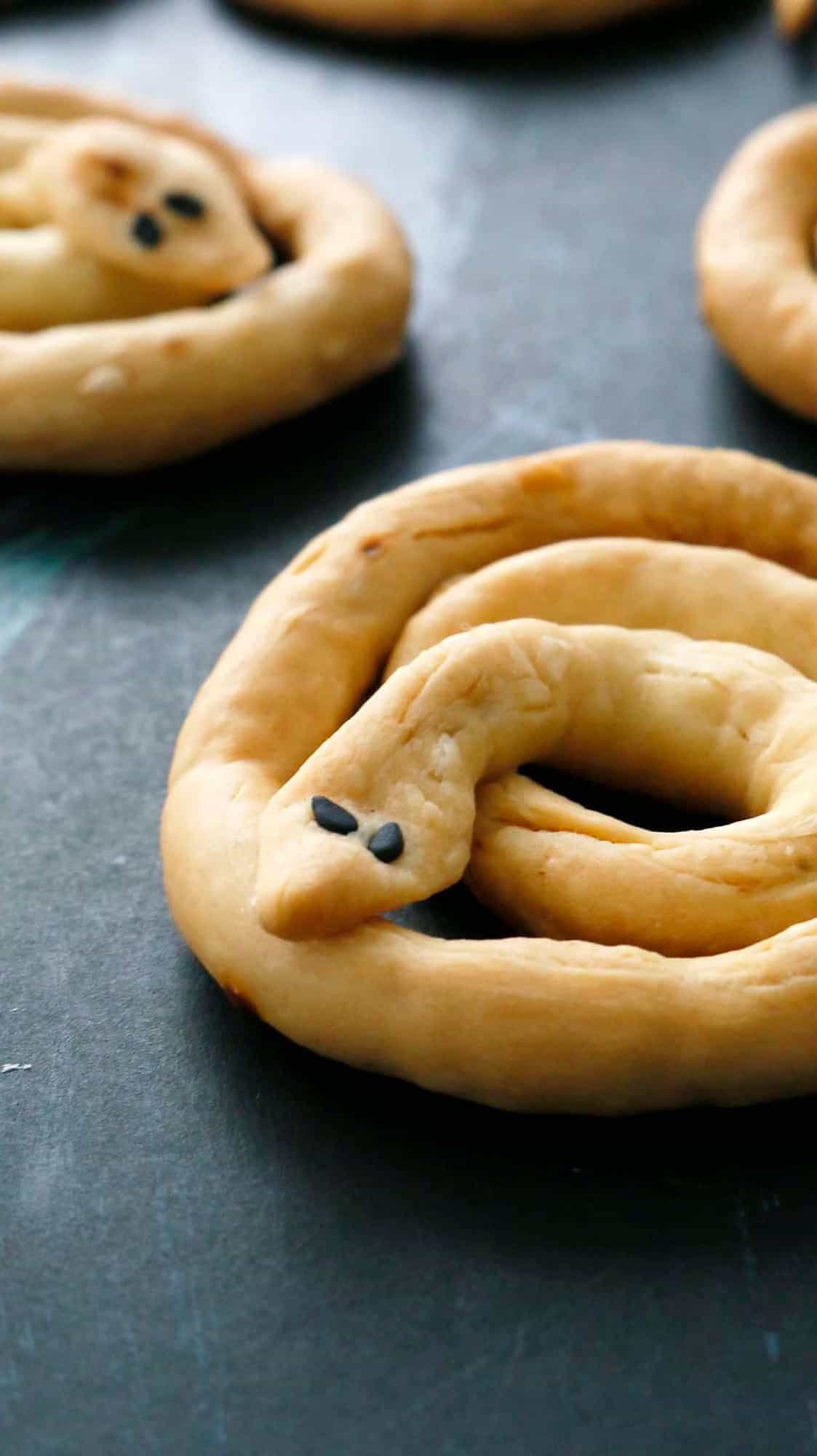 Halloween breadsticks shaped like snakes.