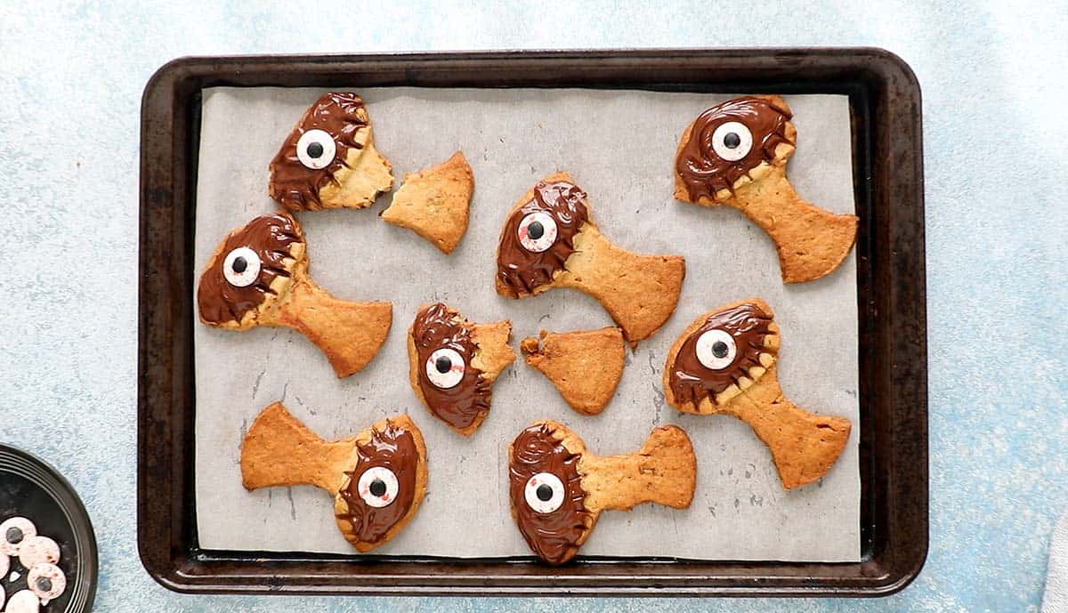 tree shaped cookies placed in a baking sheet.