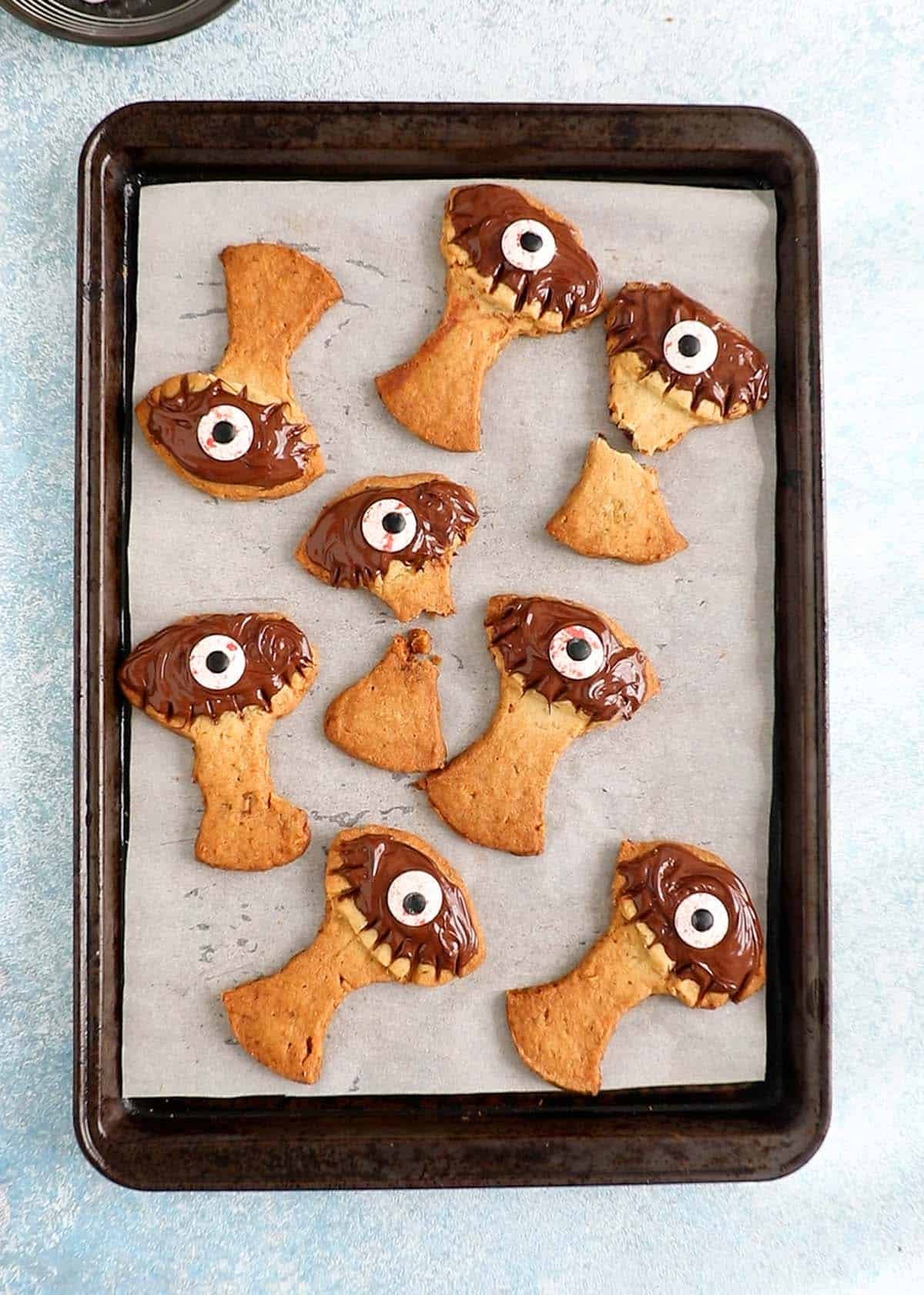 tree shaped cookies placed in a baking sheet.