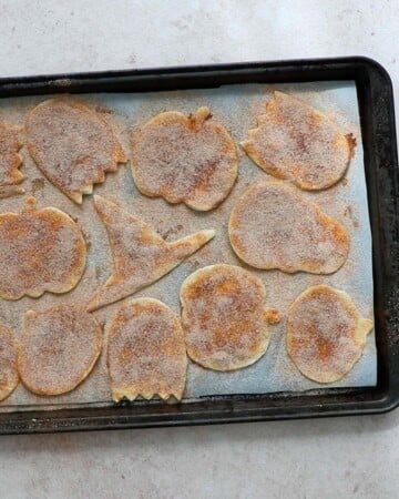 cinnamon sugar chips placed on a parchment lined baking sheet.