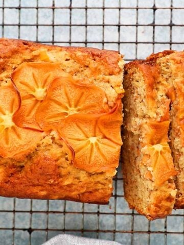 sliced persimmon bread placed on a wire rack.