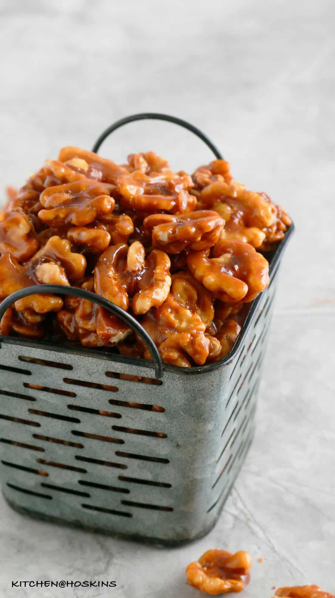 square enamel basket filled with CARAMEL WALNUTS
