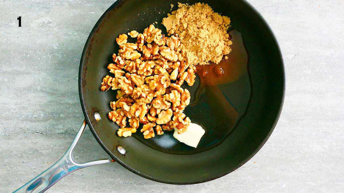 walnuts, butter, brown sugar and water placed in a black skillet.