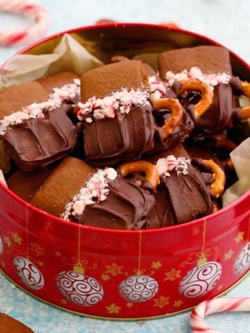 gingerbread cookies in a red cookie tin.