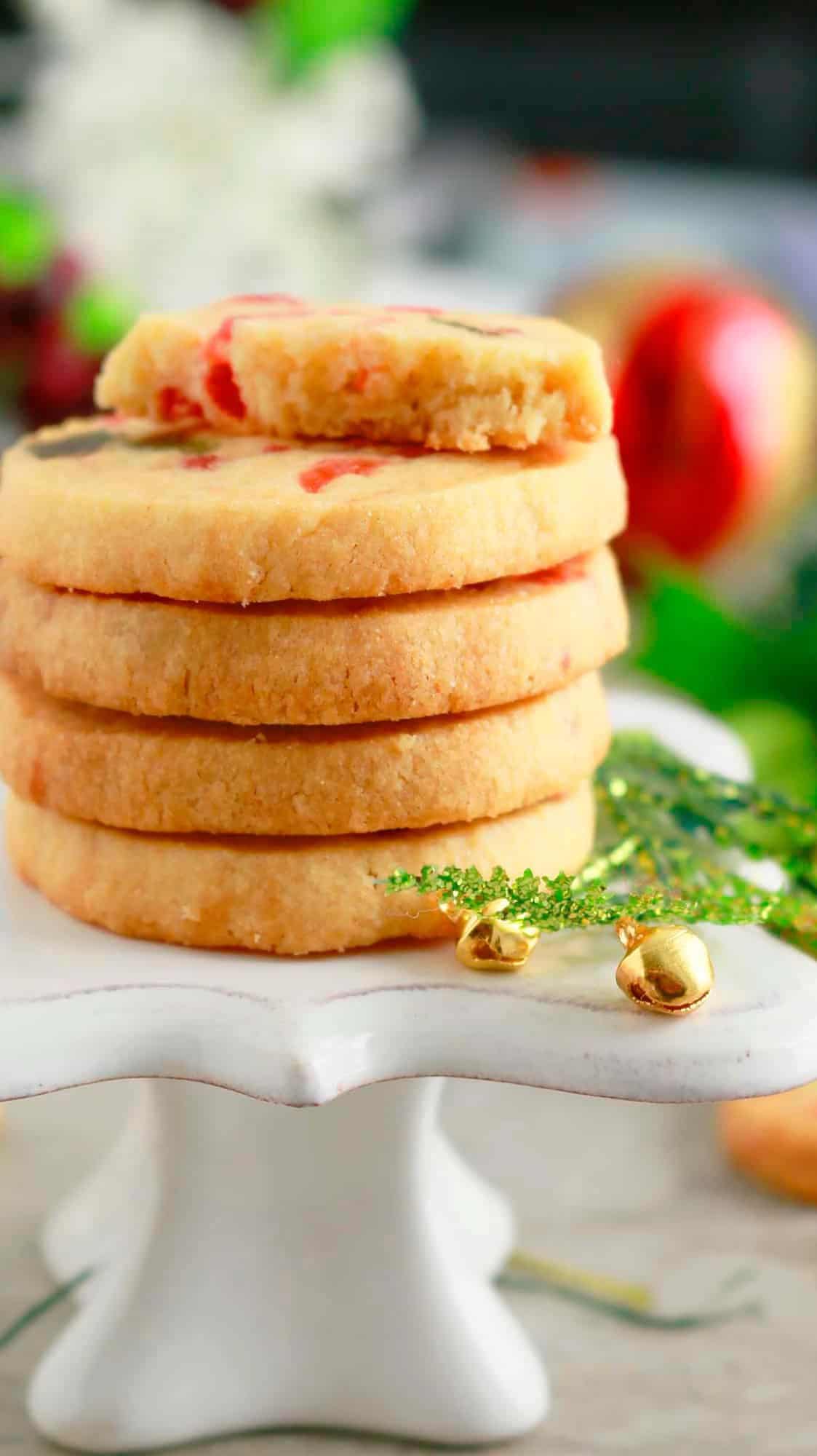 a stack of icebox cookies placed on a mini cake stand.