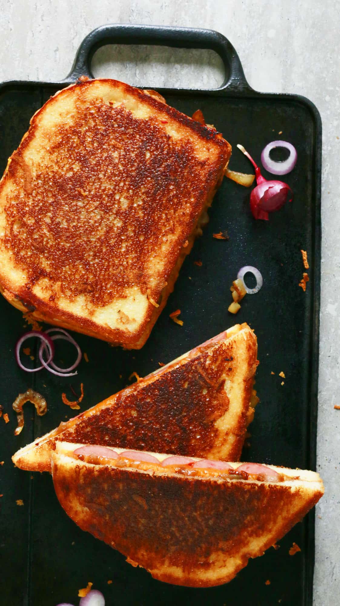 grilled cheese sandwiches with hot dogs, caramelized onions and barbecue sauce