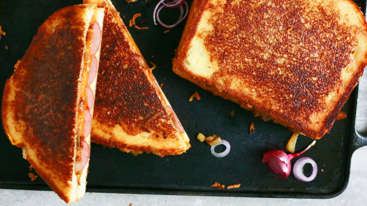 grilled cheese sandwiches with hot dogs, caramelized onions and barbecue sauce