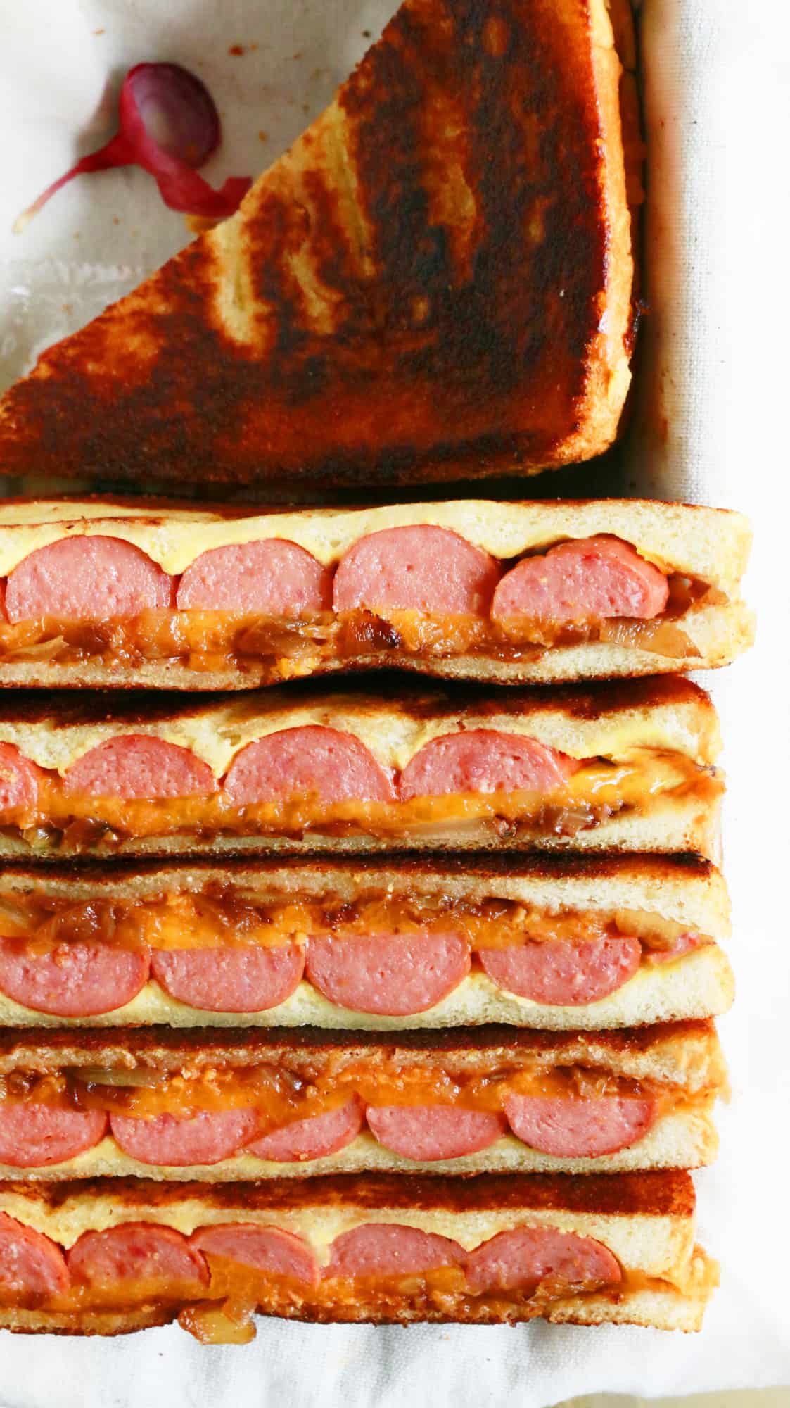 grilled cheese sandwiches with hot dogs, caramelized onions and barbecue sauce