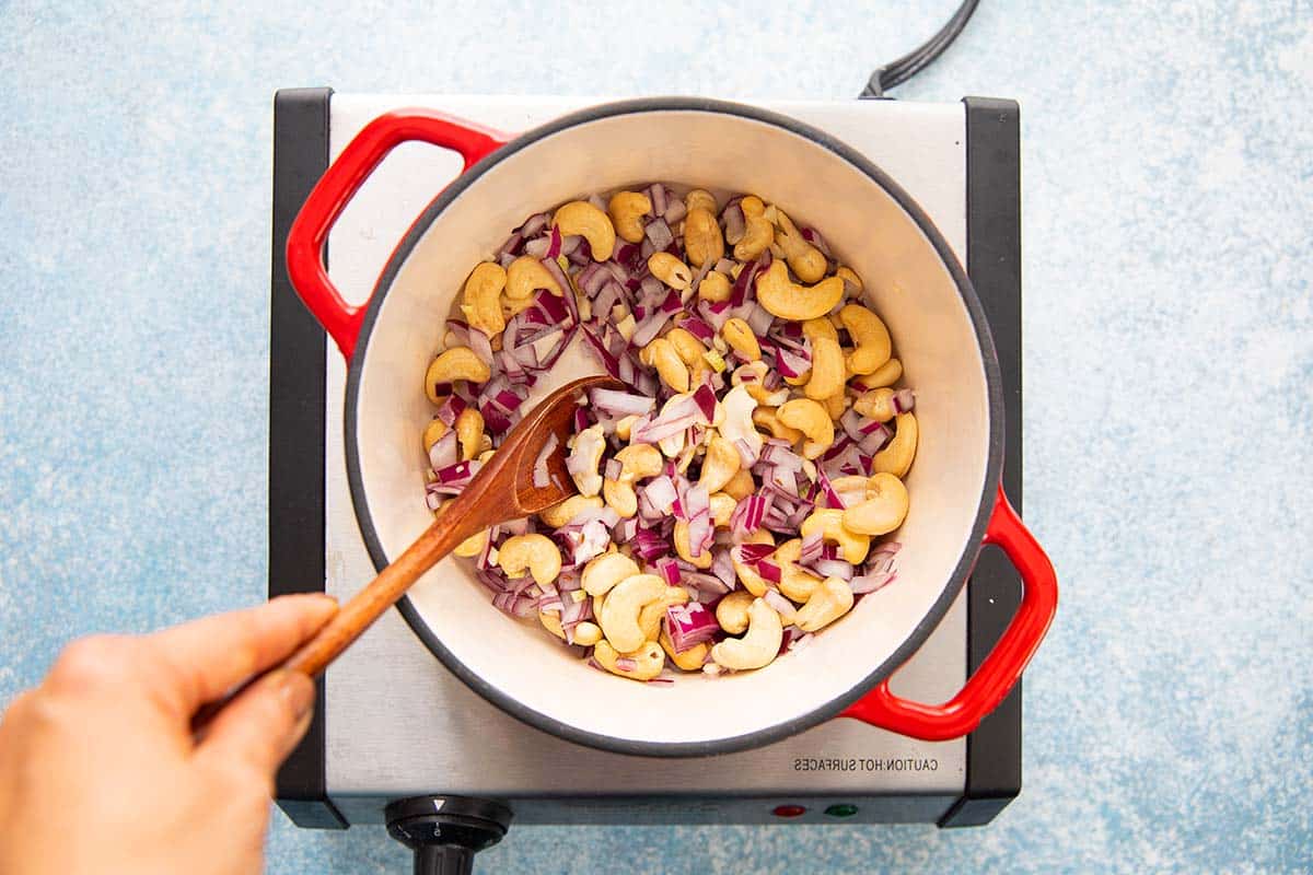 sautéing onion, garlic and cashews in a stock pot. 