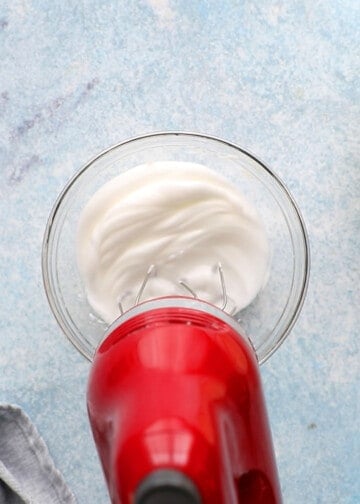 beaten egg white in a small glass bowl using red beater. 
