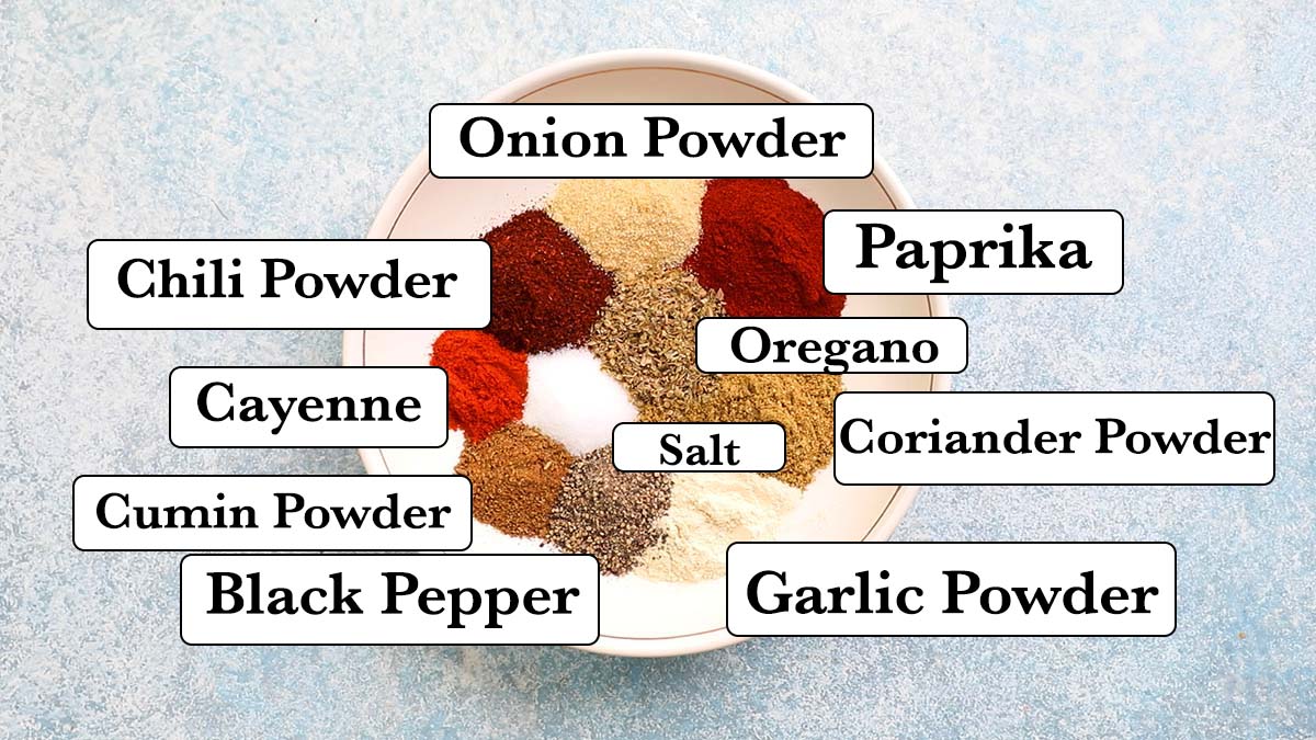 all necessary spices needed in a white bowls with labels.