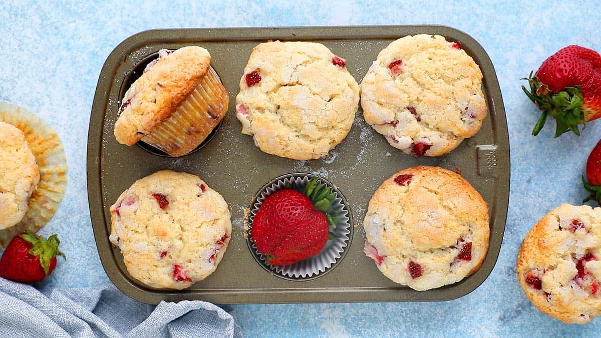 baked strawberry muffins in a 6 cup muffin pan.
