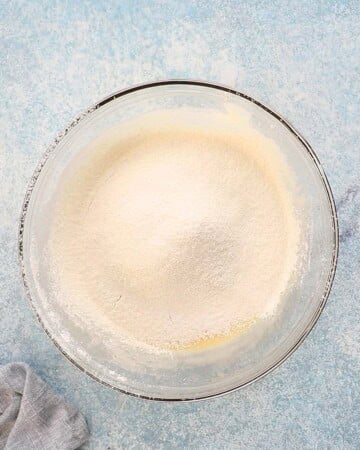 a glass bowl with white flour.