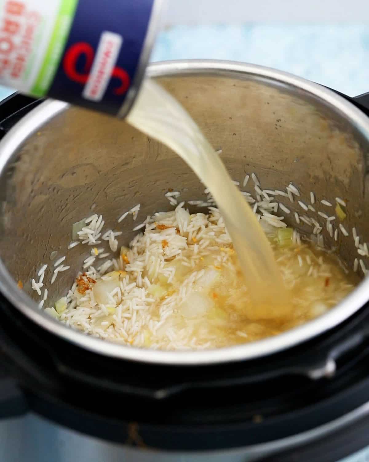 stock being poured into an instant pot.