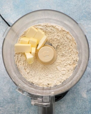 white flour and sliced butter in a food processor.