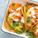 white tray with assembled shrimp tacos.