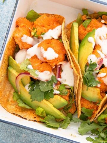 white tray with assembled shrimp tacos.