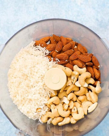 cashews, almonds and cocout in a food processor.