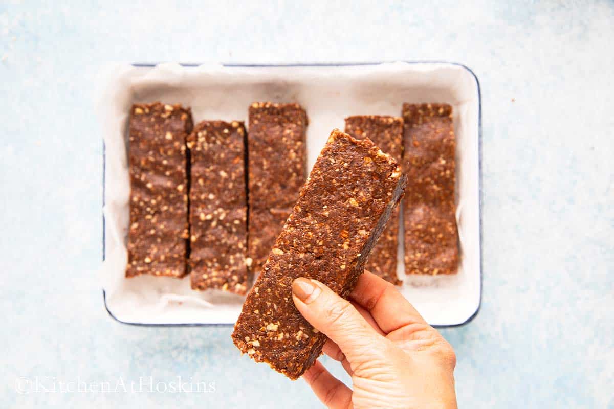 a hand holding a date bar.