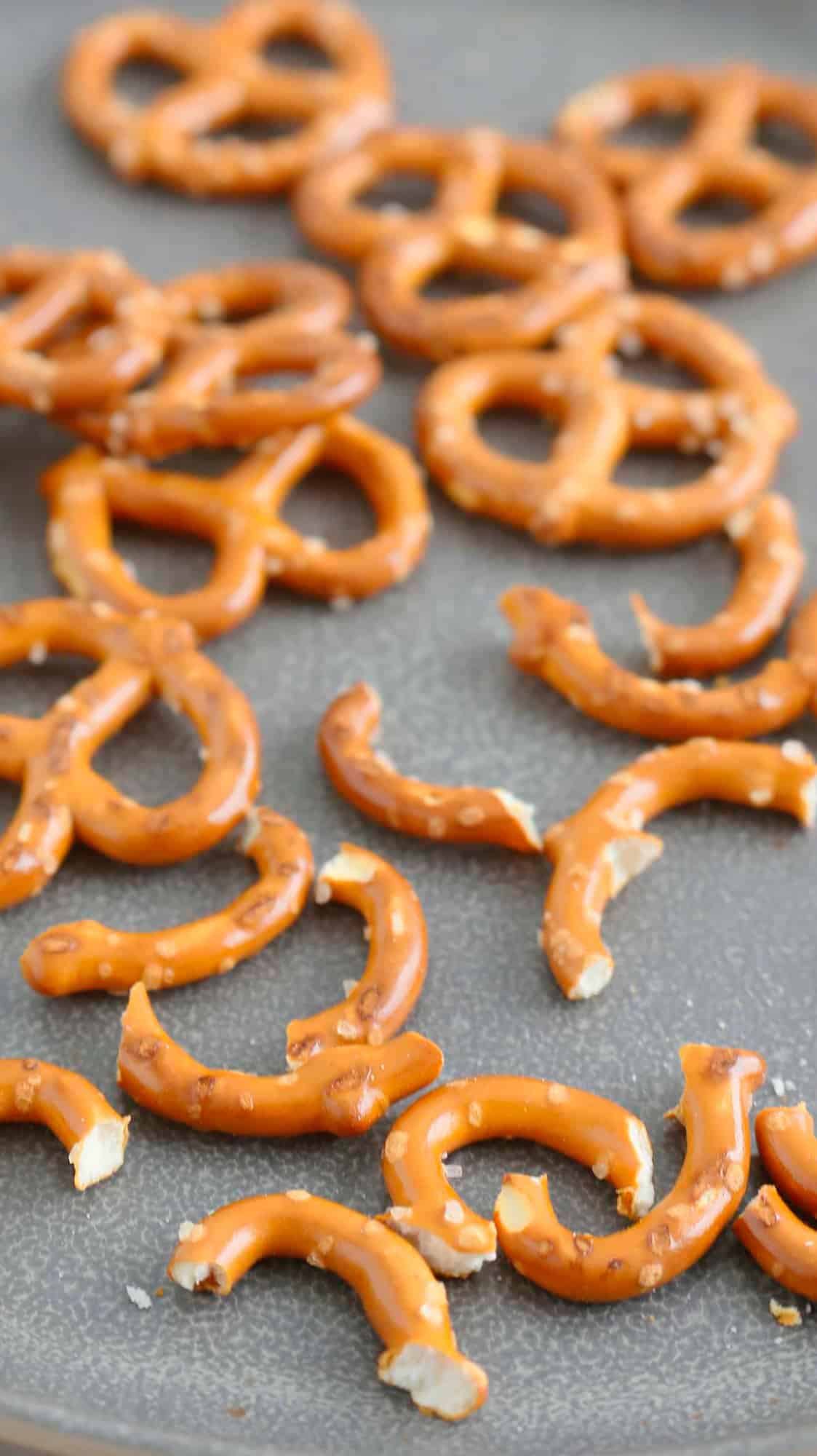 broken pretzels in a grey plate.