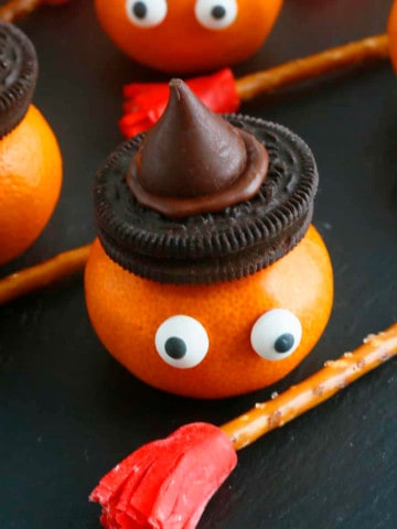halloween clementines with broom sticks.