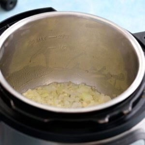 chopped onion cooking in an instant pot.