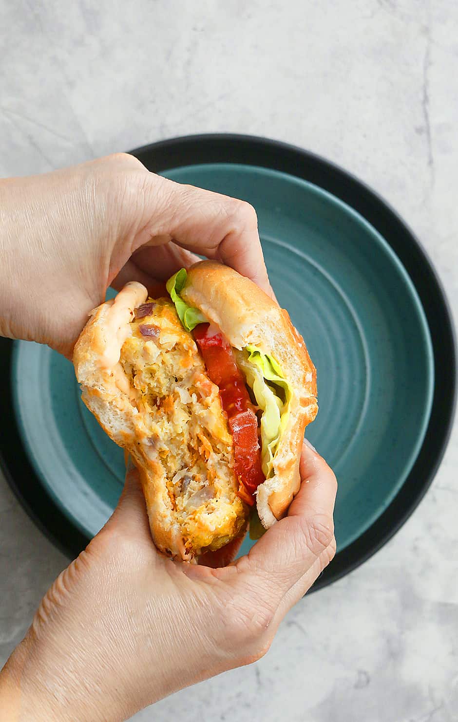 A shot of the inside of chicken burger after being taken a bite 