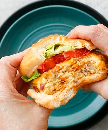 the inside shot of a half eaten chicken burger