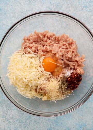 chicken meatball mixture in a large glass bowl.