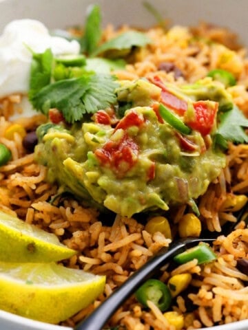 black beans and rice in a white bowl.