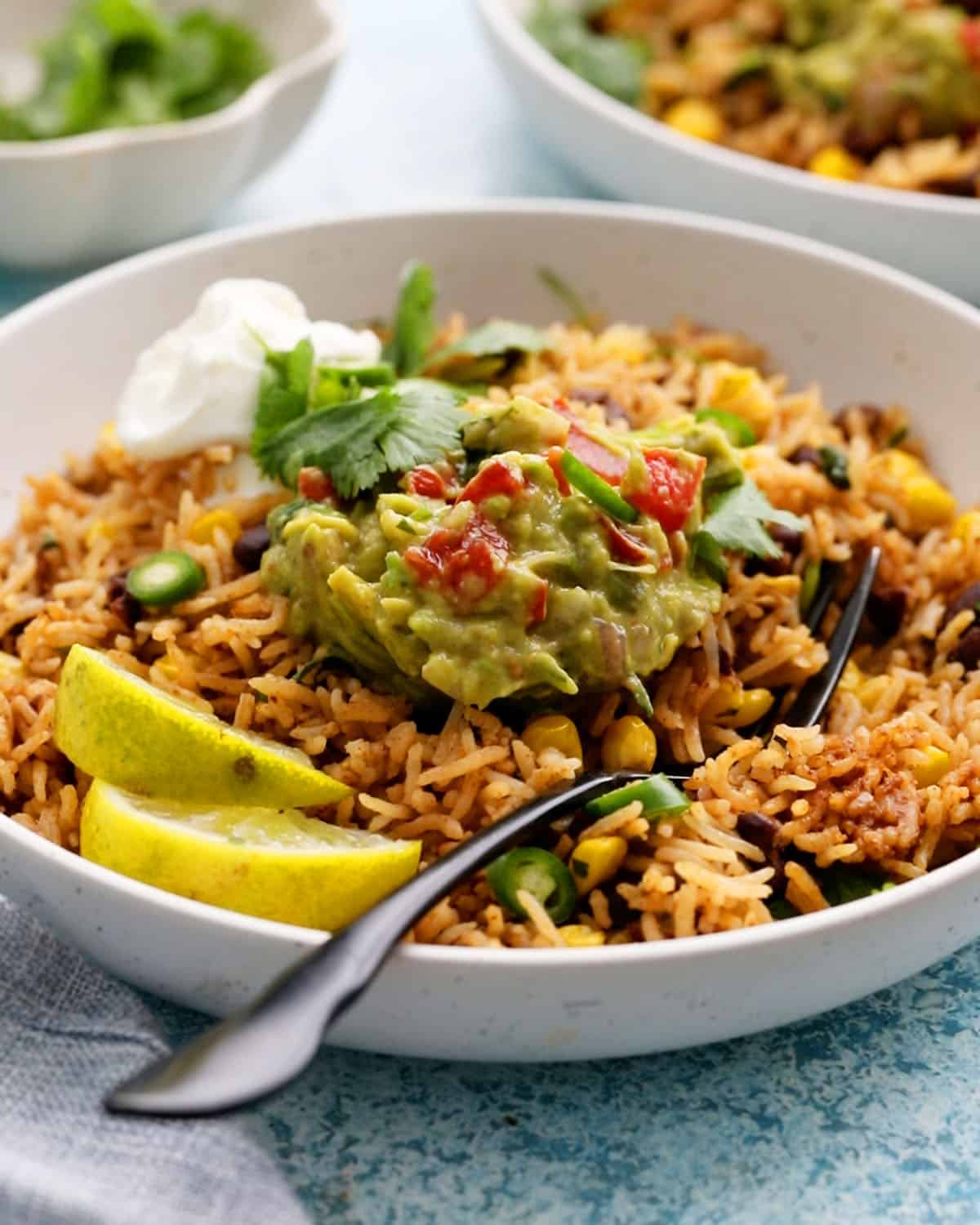 black beans and rice in a white bowl.