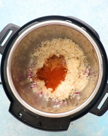 white rice and spices in an instant pot.