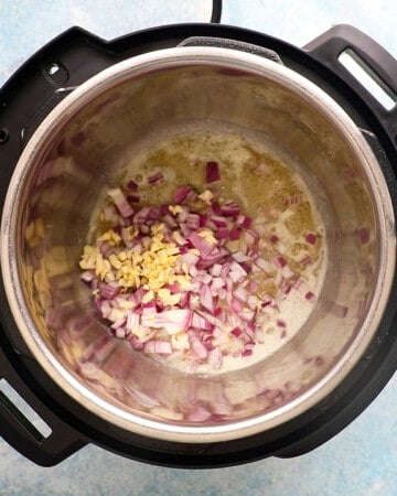 chopped and garlic cooking in an instant pot.