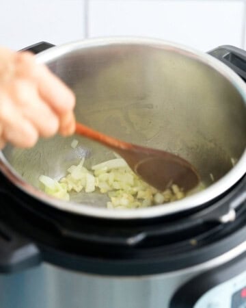 chopped onion cooking in an instant pot.