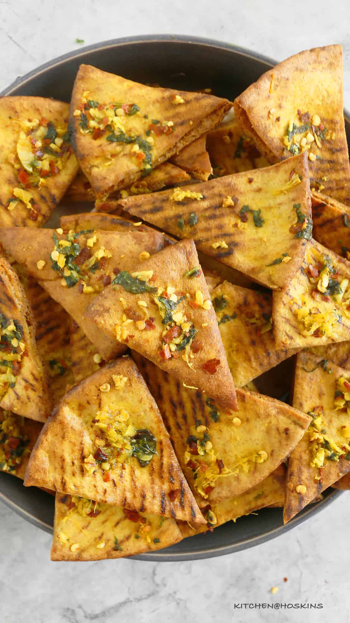 a bowl of homemade pita chips from scratch. 