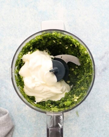 white yogurt and ground green leaves in a mini food processor.