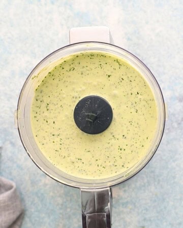 pale green sauce in a mini food processor.