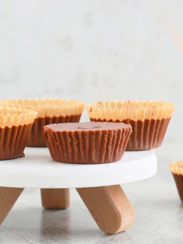 homemade almond butter cups on a small stand