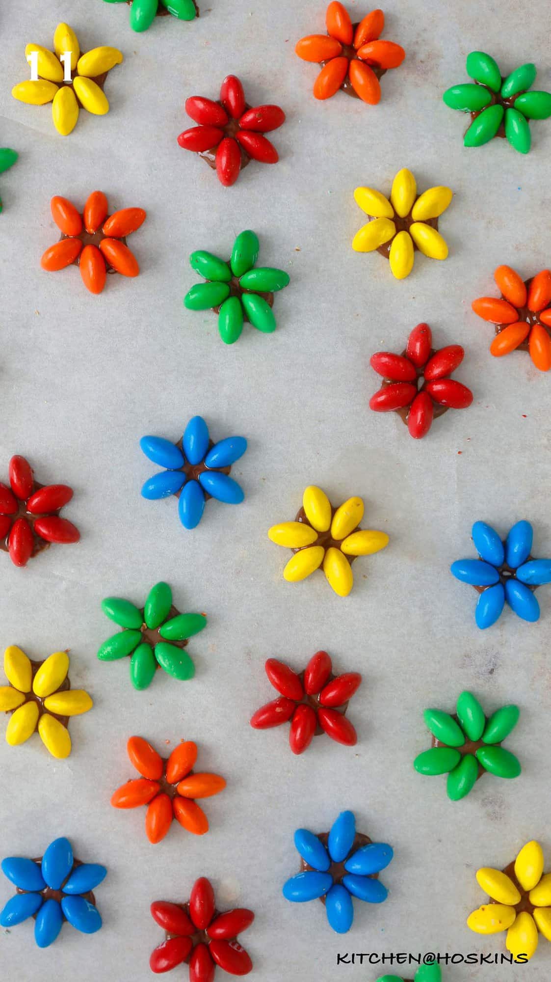 M&M flowers on a parchment paper.