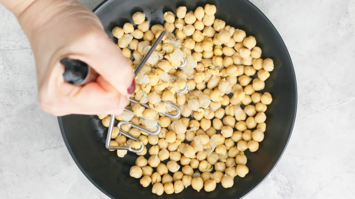 mash chickpeas with a potato masher