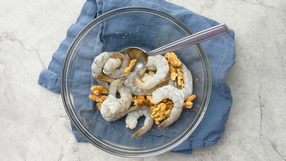 seasoned shrimp and walnut in a bowl