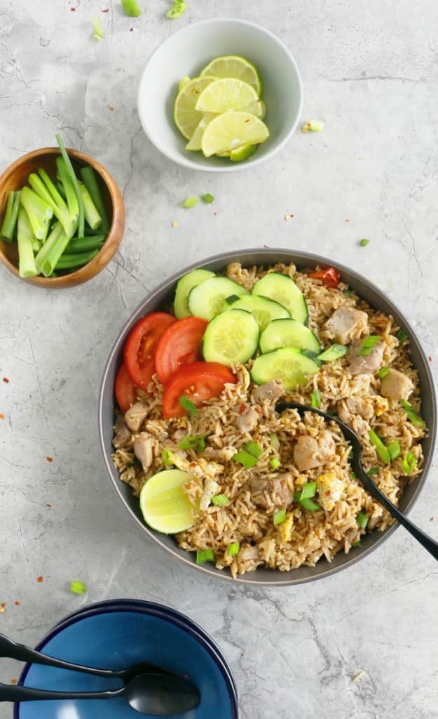 plate with thai fried rice with chicken and scrambled eggs