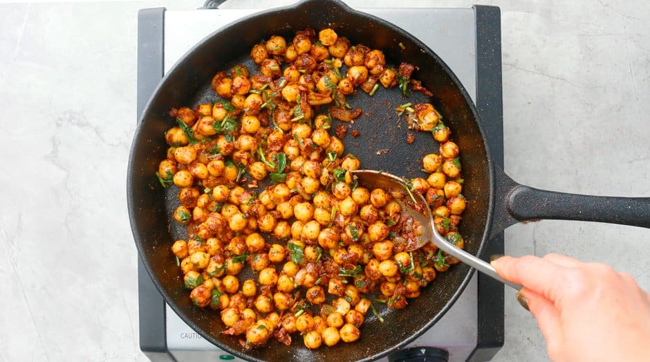 stir chopped cilantro and lime juice with chickpeas