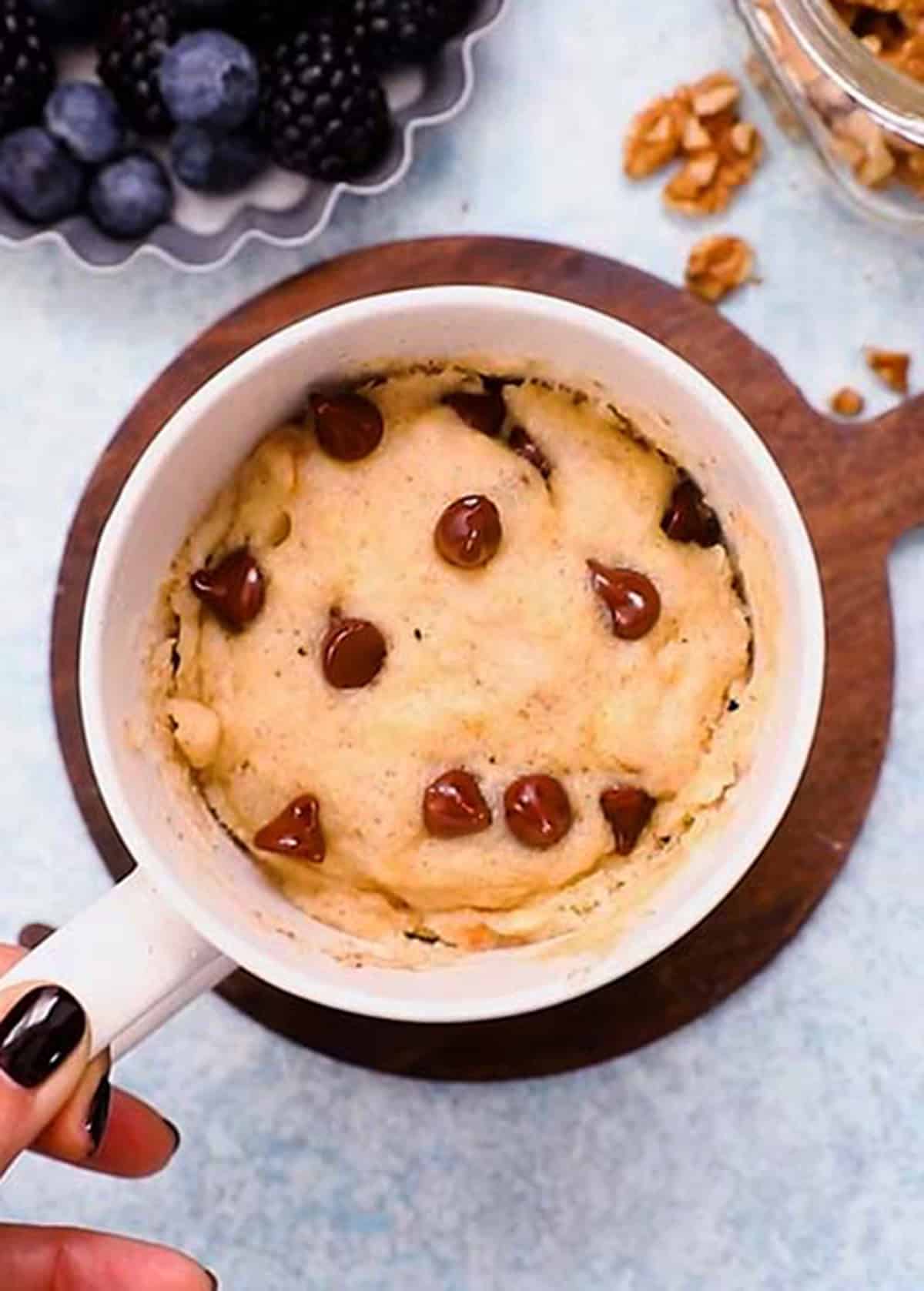 banana chocolate chip mug cake in a white mug.