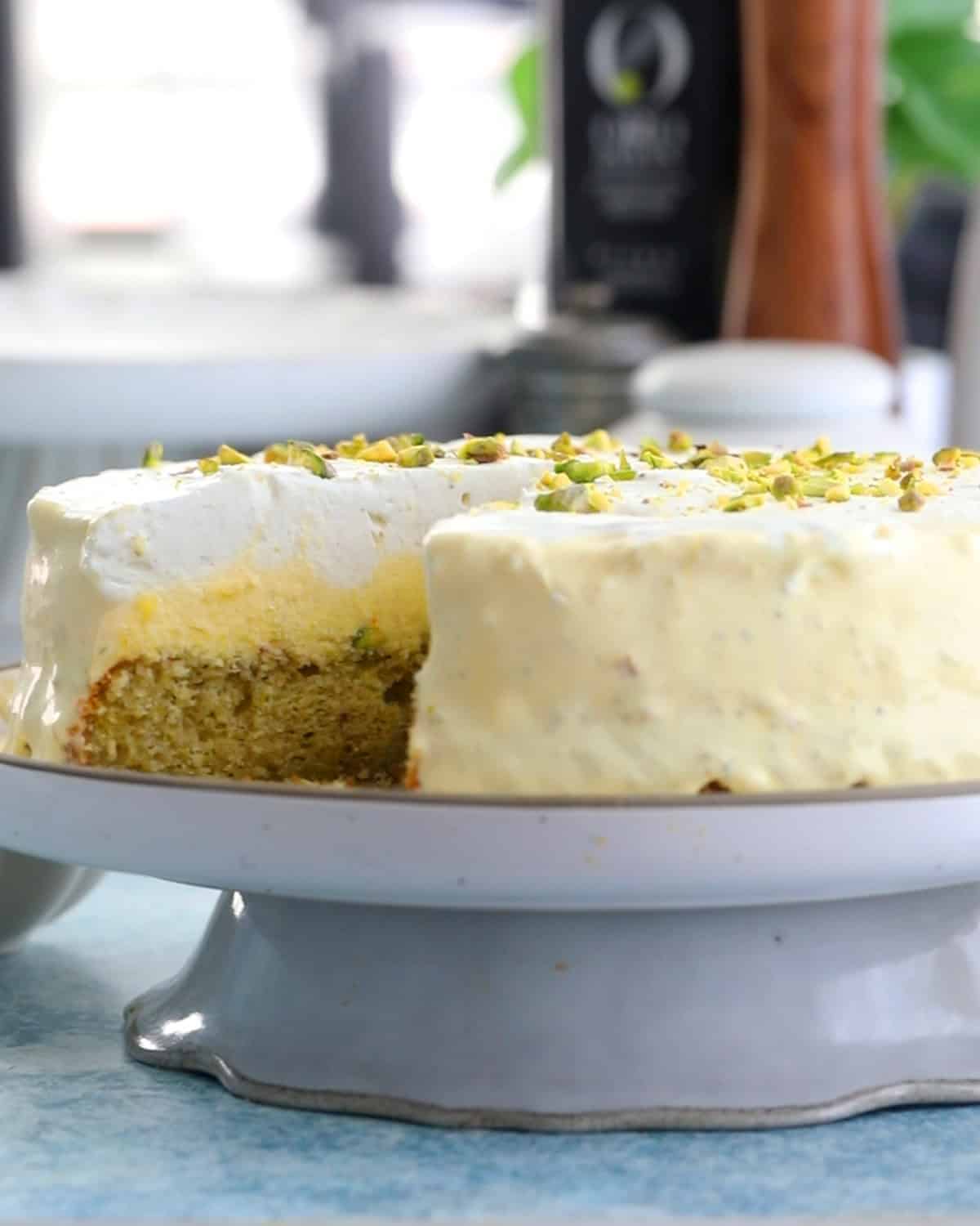 one yellow pistachio ice cream cake in a white plate.